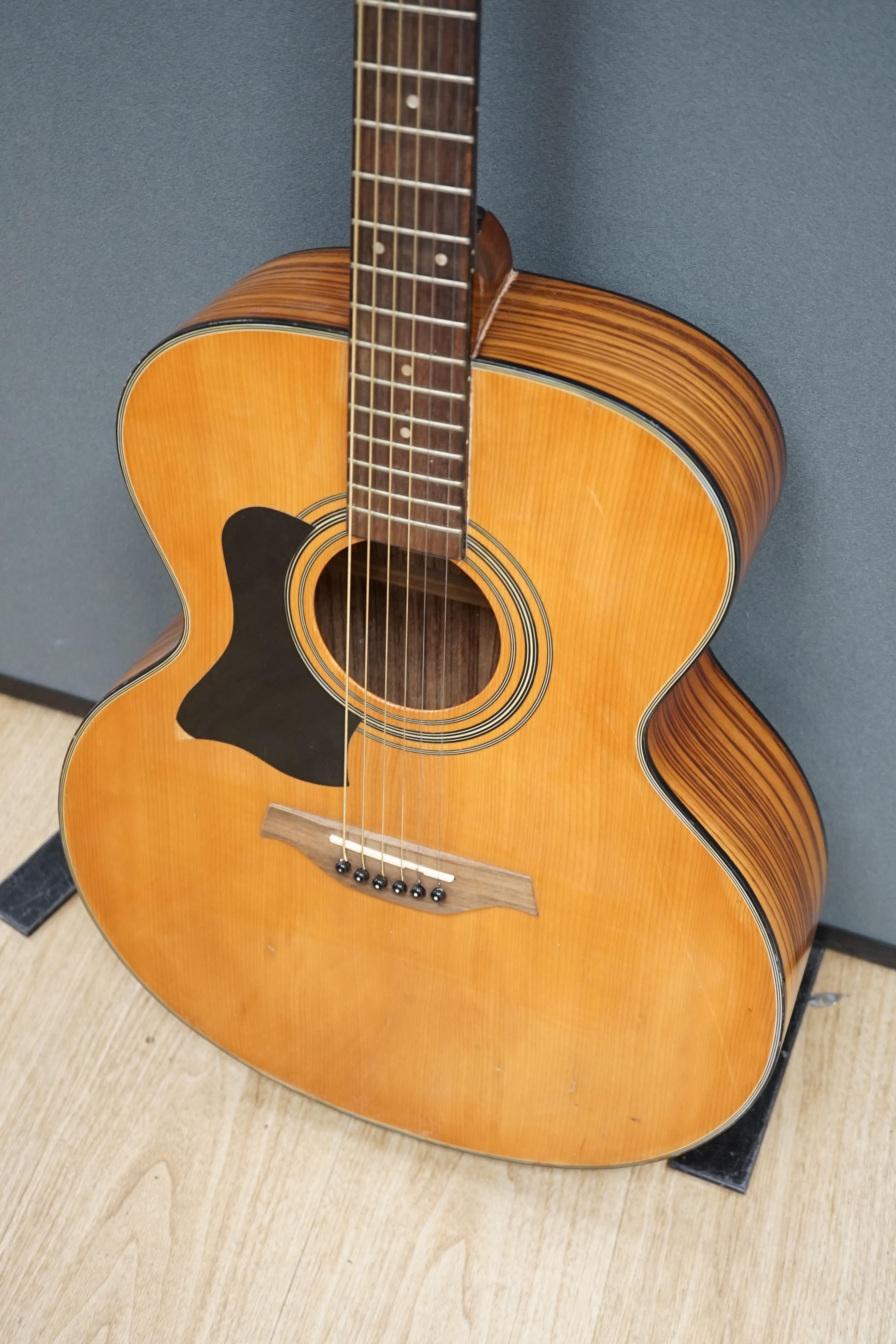 A Tanglewood acoustic guitar (left handed)